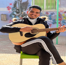 Omar playing guitar
