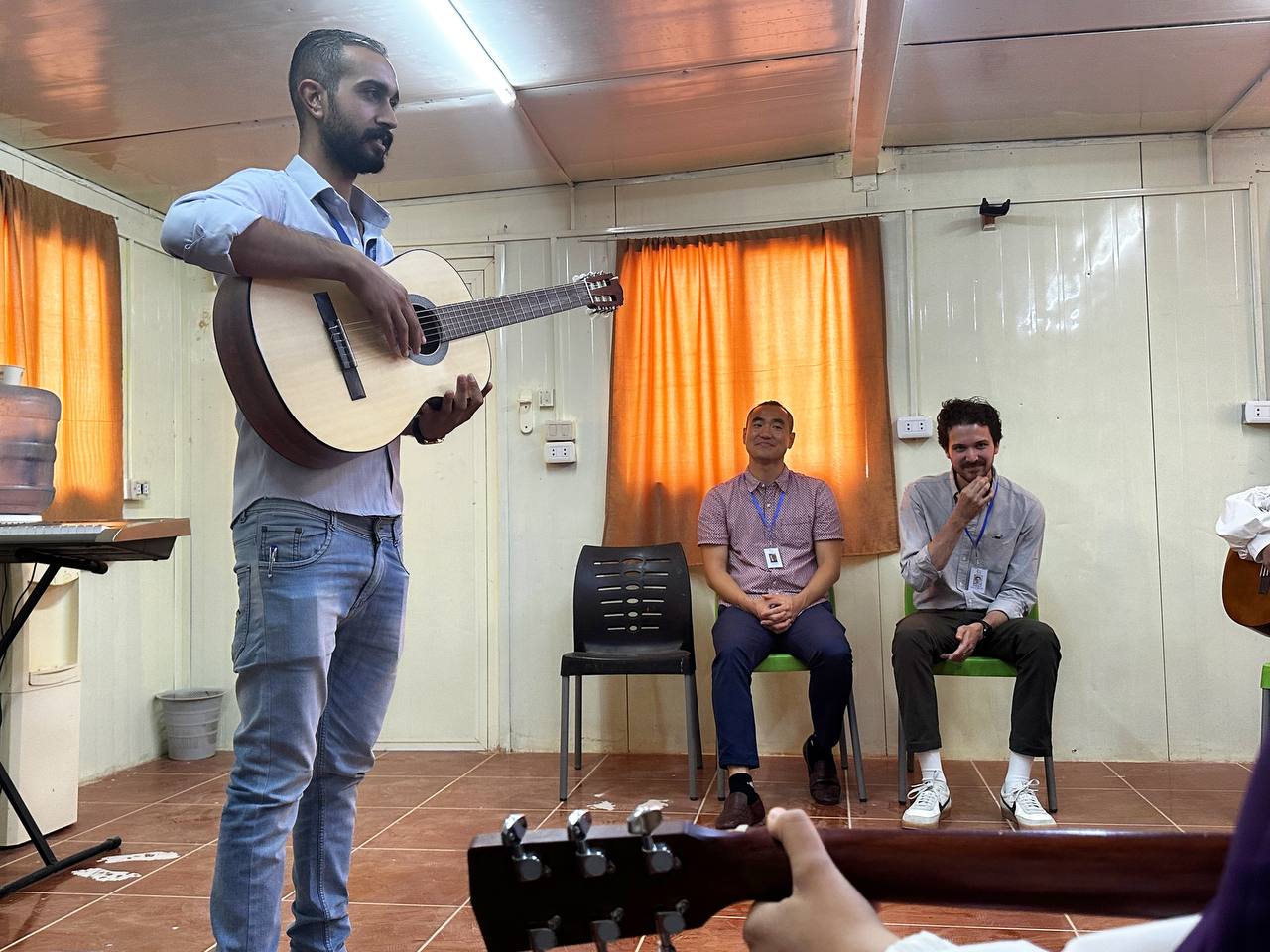 Taek and Jenson from The District Church visit our music education program
